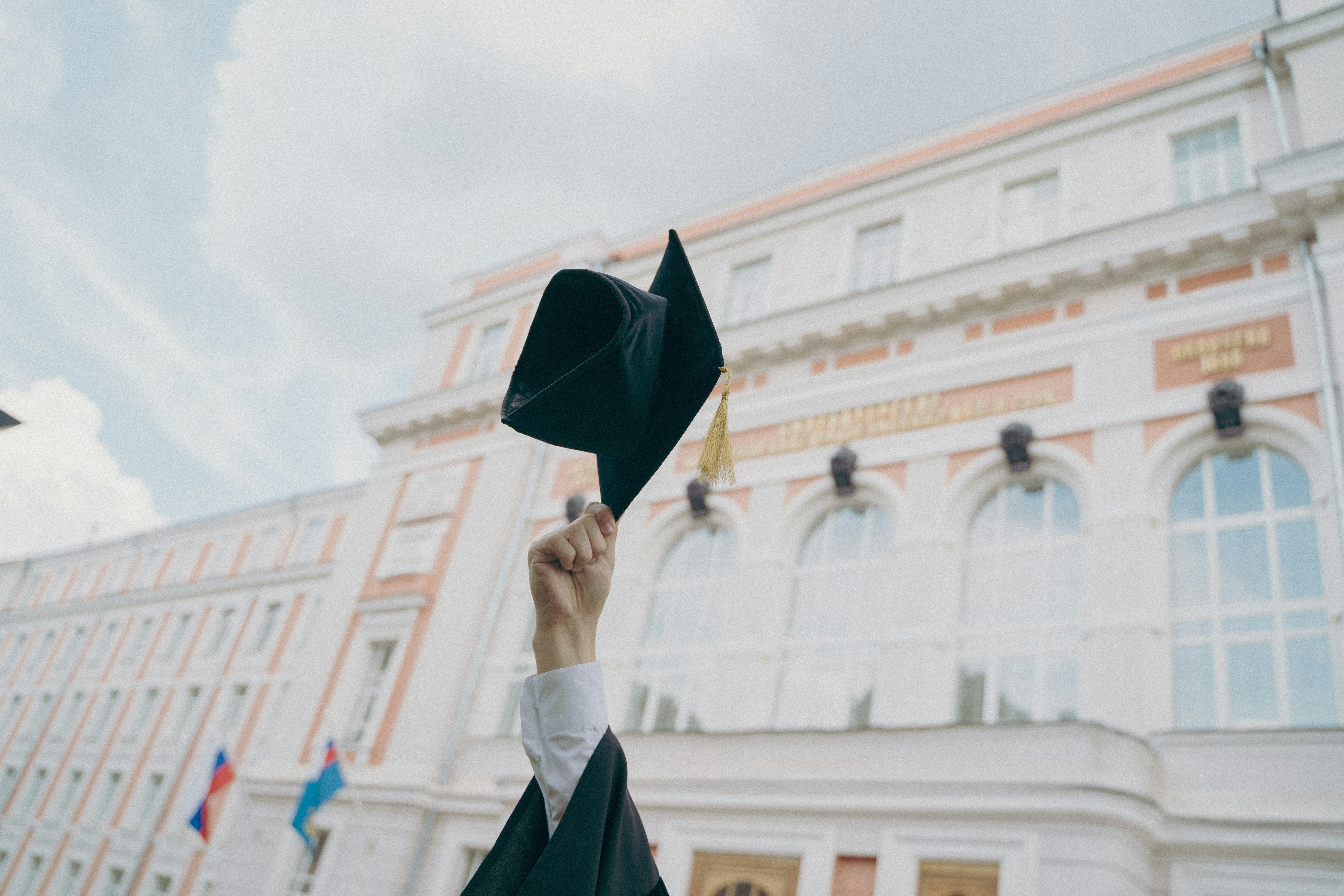 a hand raising a hand in the air implying certification